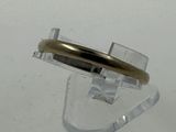 a ring that has a gold band on top of it