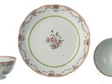 three plates and a bowl sitting next to each other