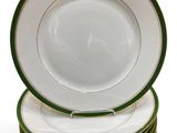 several plates stacked on top of each other on a white surface
