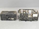 two old radio equipment sitting on top of a white surface