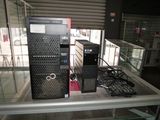 two computers that are on display in a glass case