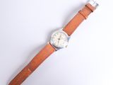 an image of a wrist watch with a brown leather strap