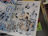 a picture of a comic book open on a table