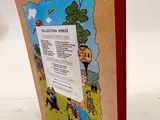 an old children ' s book with a picture of a farm scene on it
