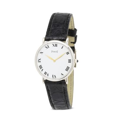 a close up of a wrist watch with roman numerals