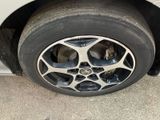 a close up of a tire on a car ' s rim