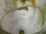 a close up of a blender with a liquid inside of it