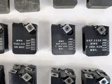 many different types of electronic components displayed on a white surface