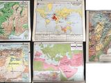 several maps of the world are displayed on a black surface