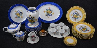 many plates and cups that are sitting on a table