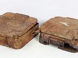 two old suitcases sitting next to each other on a white surface