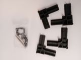a lot of screws and nuts on a white surface