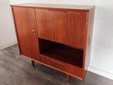 an image of a cabinet with a door and drawers