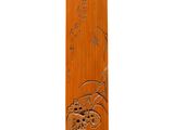 a wooden vase with a design on it on a white surface
