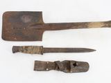 two old tools are sitting next to each other on a white surface