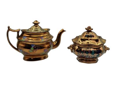 pair of antique brass teapots with lids and handles
