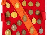 a red cloth bag with a bunch of coins on it