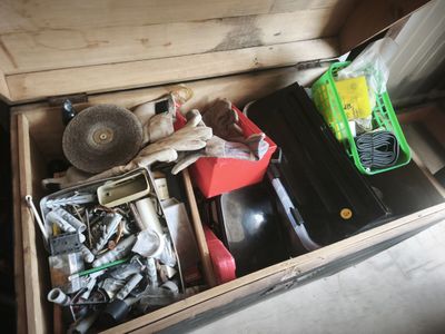 a wooden box filled with assorted tools and tools