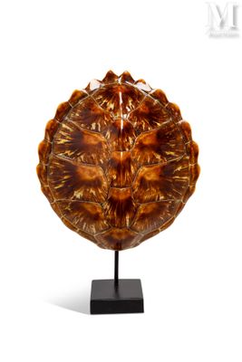 sculpture of a pie on a stand on a white background