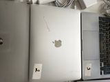 two laptops that are sitting next to each other on a table