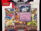 two packs of pokemon trading cards are in a package