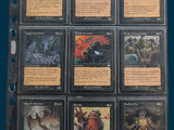 a lot of cards that are in a binder
