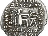 a silver coin with an image of a man on a horse