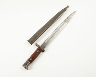 two knives are laying side by side on a white surface