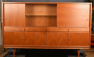 an image of a wooden cabinet with shelves and drawers
