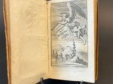 an open book with a drawing of a man on a horse