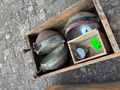 a box with a bunch of gas cans inside of it