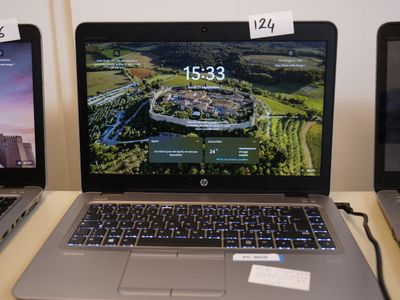 three laptops that are sitting on a table