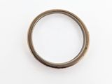 a close up of a ring on a white surface