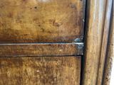 a close up of a piece of furniture with a wooden door