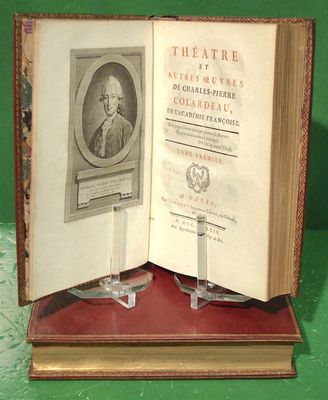 an open book with a picture of a man on it