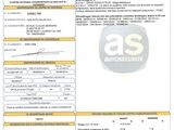 un gros plan d'un document sur lequel figure la photo d'une voiture