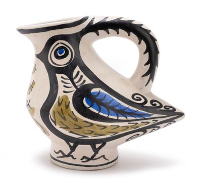 an image of a ceramic vase with a bird on it