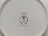 a white plate with a black and white design on it