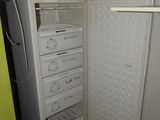 a refrigerator with a lot of drawers inside of it