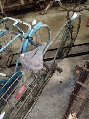 a blue bicycle that is parked in a garage