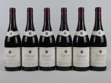 six bouteilles de vin rouge alignées