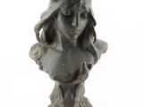 sculpture of a woman ' s head on a bust on a white background