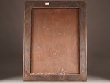 an old wooden picture frame on a white surface with a brown background