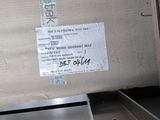 a piece of paper taped to the side of a machine