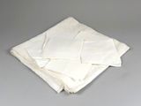 several white napkins stacked on top of each other on a table