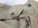 a close up of a bag with a metal clasp on it