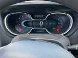 dashboard view of a car with a steering wheel and gauges