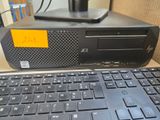 a computer with a keyboard and mouse on a desk