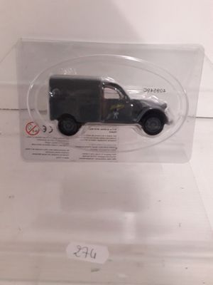 a small toy truck in a clear plastic box