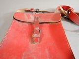 a red bag that is sitting on a table